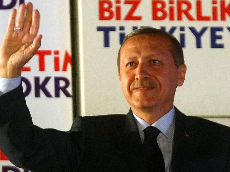 SWEET VICTORY: Turkish Prime Minister Recep Tayyip Erdogan's Islamist-rooted Justice and Development Party (AKP) won a crushing majority in the parliamentary election for a third straight win, with nearly 50 percent of the vote. (Adem Altan/AFP/Getty Images)