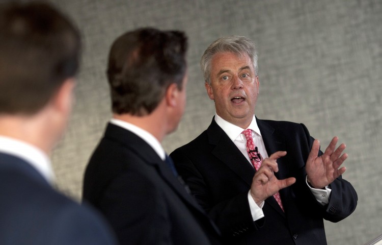 Health Secretary Andrew Lansley (R) speaks beside Prime Minister David Cameron (C) and Deputy Prime Minister Nick Clegg as they address hospital staff and media at Guy's Hospital on June 14, 2011 in London. (Paul Rogers/WPA Pool/Getty Images)