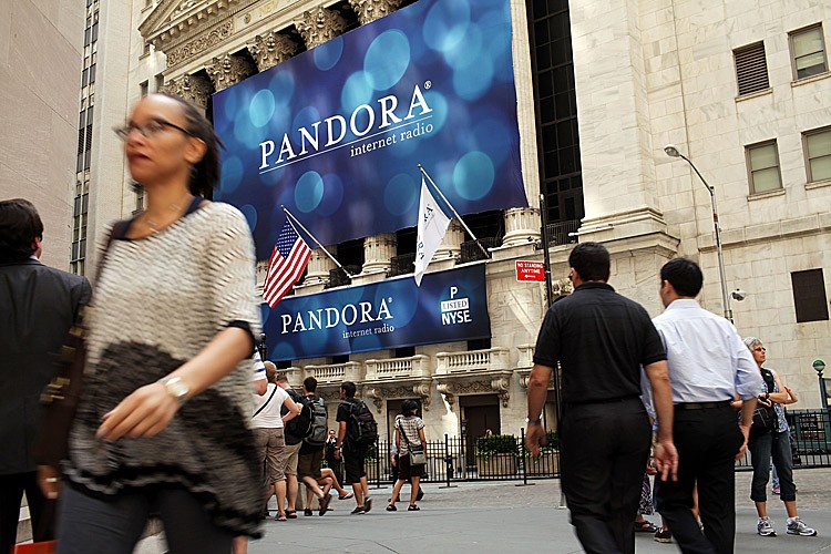 IPO FEVER: A banner for Pandora Media Inc., an online-radio company, hangs in front of the New York Stock Exchange on the day of its initial public offering (IPO) of stock, June 15. Pandora's stock rose as much as 63 percent to $26 following its debut. (Spencer Platt/Getty Images)
