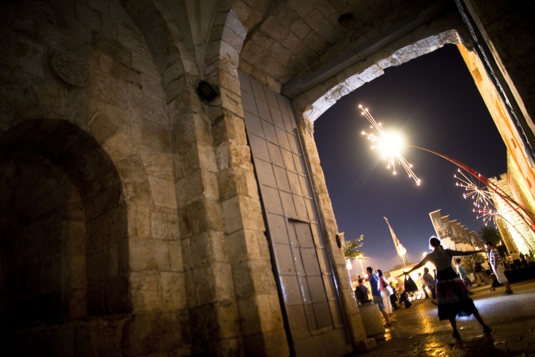 A girl poses for a photograph during the Jerusalem Festival of Lights on June 15, 2011 at Jerusalem's Old City, Israel. (Uriel Sinai/Getty Images)