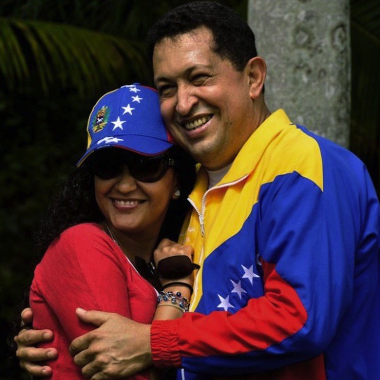 Venezuelan President Hugo Chavez Frias (R) with his daughter Rosa Virginia, during a walk as part of his rehabilitation at the hospital's gardens in Havana on July 2.  (Estudios Revolucion/AFP/Getty Images)