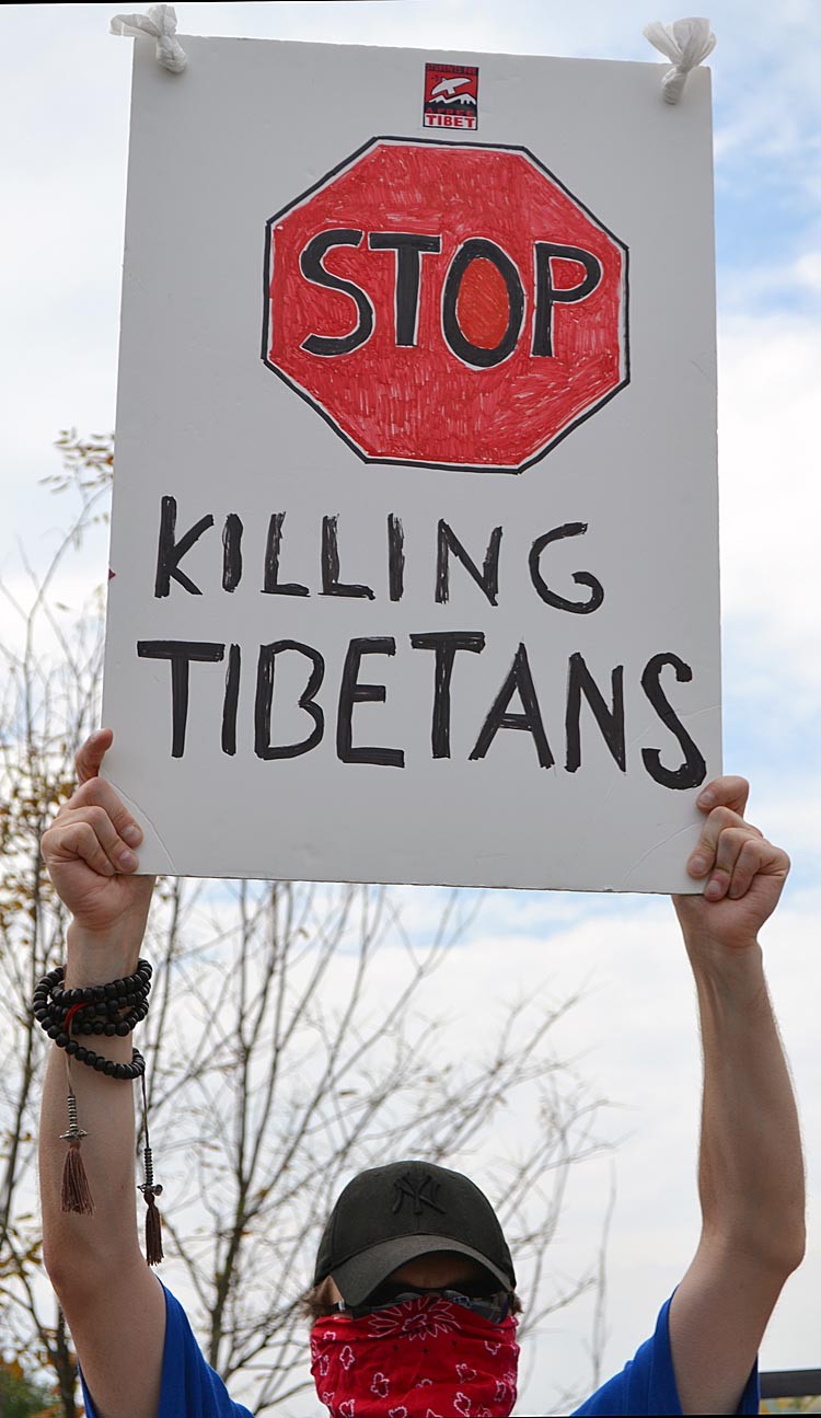 A protester holds a sign during the Tibetan protest in front of the Chinese Embassy in Washington, DC on July 13. The protest was held in opposition of the Chinese government's planned celebration of the 60 years of Chinese rule over Tibet, and was organized by the Students for a Free Tibet. (Hannah HOFFMAN/AFP/Getty Images)