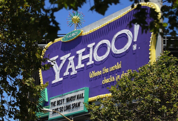 A Yahoo! billboard is visible through trees on July 19, in San Francisco, California. Reportedly, Chinese internet commerce company Alibaba recently expressed interest in buying Yahoo Inc.  (Justin Sullivan/Getty Images)