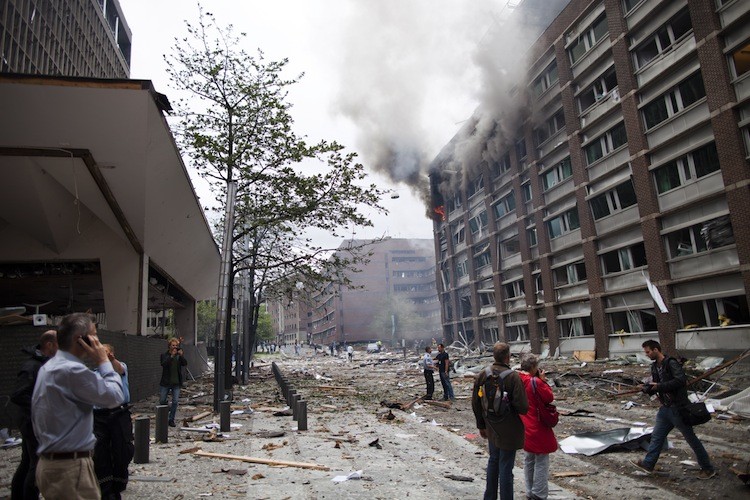 Smoke rises from a building after a powerful bomb blast rocked government and media buildings in Norway's capital Oslo on July 22, causing 'deaths and injuries' and dealing heavy damage. (Thomas Winje/AFP/Getty Images)