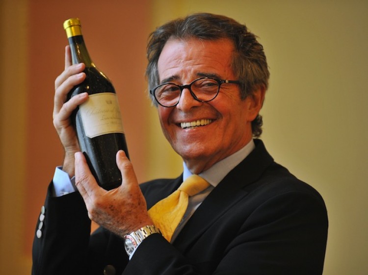 MOST EXPENSIVE: French private collector Christian Vanneque holds the bottle of 1811 Chateau d'Yquem, which has set a new world record for the most valuable bottle of white wine, during a photocall in central London, on July 26. (Ben Stanall/AFP/Getty Images)