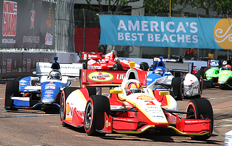 Helio Castroneves speeds through the streets of St. Petersburg. IndyCar will be bringing its intense street-racing action to Houston starting in 2013. (James Fish/The Epoch Times)