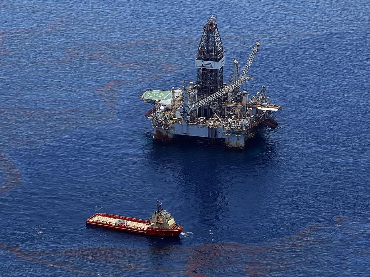 Crews on ships work on stopping the flow of oil at the source site of the Deepwater Horizon disaster on May 29, 2010 in the Gulf of Mexico near Venice, Louisiana. No solid figures exist for how much oil was spilled or how much damage it will ultimately do to the Gulf. (Win McNamee/Getty Images)