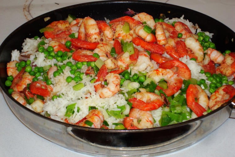 No need to order shrimp fried rice take-away any more—you can make it yourself. Double the ingredients and this fast and easy recipe will become a staple dinner dish for the family. 