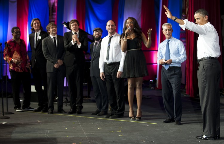 President Obama (R) walks on stage at the Aragon Ballroom in Chicago, Illinios, August 3, as Herbie Hancock (L), members of the band OkGo (C), Jennifer Hudson (3rd R) and Chicago Mayor Rahm Emanuel (2nd R) sing 'happy birthday' to him.  (Jim Watson/Getty Images)