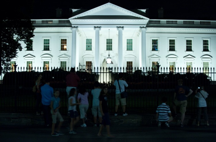 People stand outside the White House on August 5, 2011. (Nicholas Kamm/AFP/Getty Images)