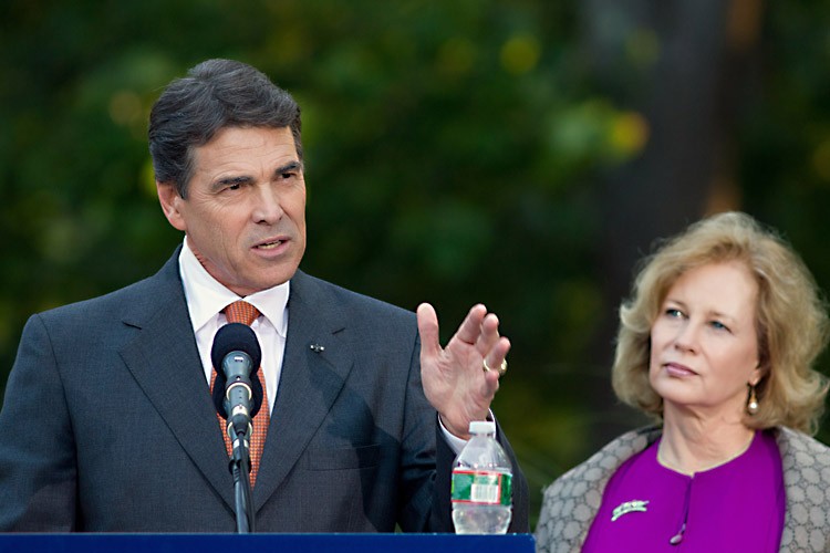 CAMPAIGNING: Texas Gov. and Republican presidential hopeful Rick Perry speaks at a campaign event with his wife Anita on Aug. 13 in Greenland, N.H. (Matthew Cavanaugh/Getty Images)