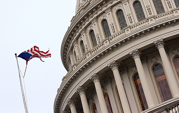 OH SAY CAN YOU SEE: The American flag flies in tatters above the U.S. Capitol after Hurricane Irene moved through the nation's capital on Aug. 28. Hurricane Irene left more than 2 million people without power, and on Sunday came ashore in New Jersey and was downgraded to a tropical storm. (Win McNamee/Getty Images)