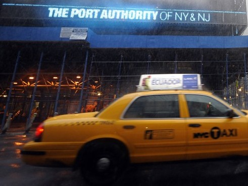 A taxi passes by the Port Authority in New York City. (TIMOTHY A. CLARY/AFP/Getty Images)