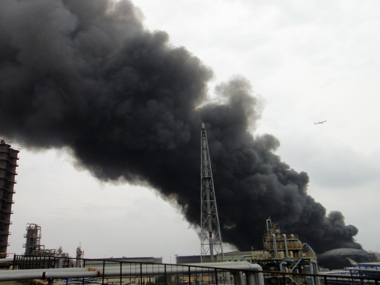 Smoke billows from a fire at Chinese state-owned oil giant PetroChina's largest oil refinery in Dalian, in China's northeastern Liaoning Province, on Aug. 29, 2011.  (AFP/Getty Images)