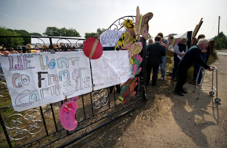 Residents of the Dale Farm travelers' site near Basildon in Essex, in southeast England, leave the communal area after addressing the media at a press conference, on September 2, 2011. (Leon Neal/AFP/Getty Images)