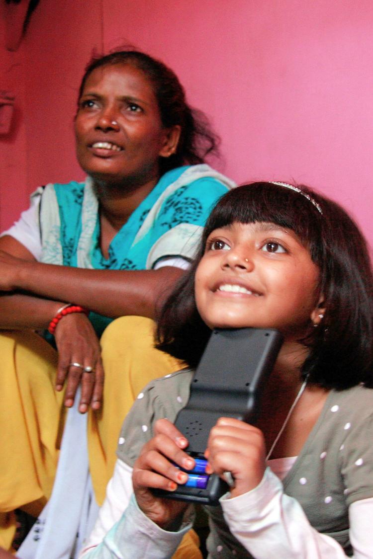Actor Rubiana Ali plays alongside her mother at her home on March 3, in Mumbai, India. Rubiana starred in the Academy Award-winning film 'Slumdog Millionaire'. (Ritam Banerjee/Getty Images)