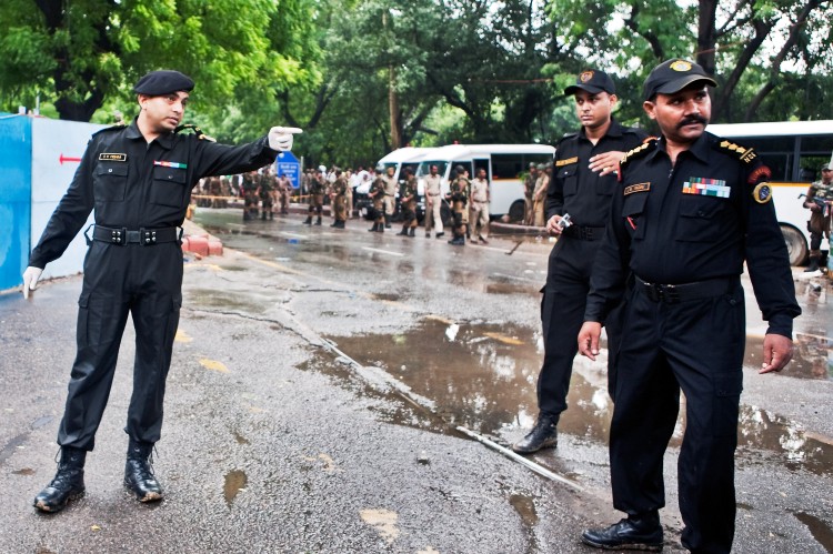 Indian National Security Guard commandos inspect the scene of a bomb blast outside Delhi's High Court on September 7, 2011 in Delhi, India.  (Ravi Mishra/Getty Images)