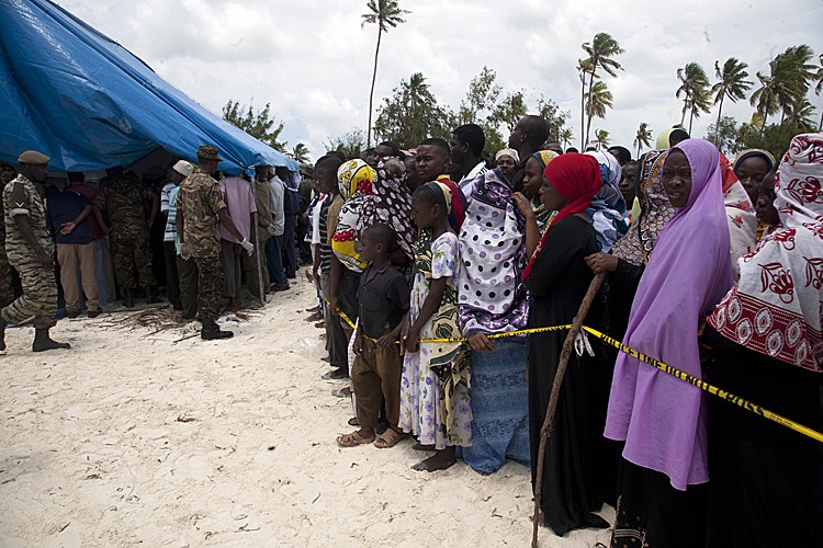 Tanzanians residing on the Island of Zanzibar wait at a beach to identify bodies retreived from the sea September 10, after an overloaded ferry sank overnight after sailing off from the commercial capital, Dar es Salaam en route to Zanzibar. (STRINGER/AFP/Getty Images) Tanzanians residing on the Island of Zanzibar wait at a beach to identify bodies retreived from the sea September 10, after an overloaded ferry sank overnight after sailing off from the commercial capital, Dar es Salaam en route to Zanzibar. (STRINGER/AFP/Getty Images)