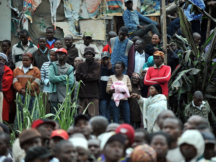 Residents of a shantee in Nairobi react to an oil pipeline explosion on September 12, 2011. (Tony Karumba/AFP/Getty Images)