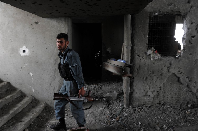 An Afghan security personnel stands at the site where Taliban fighters launched a coordinated attack in Kabul, on September 14, 2011. (Shah Marai/AFP/Getty Images)