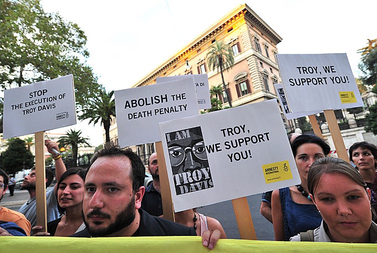 Amnesty International activists hold banners in support of Troy Davis in front of the US Embassy in Rome on September 16, during a protest to denounce the death penalty in the United States. Davis was sentenced to death in 1991. (ALBERTO PIZZOLI/AFP/Getty Images)