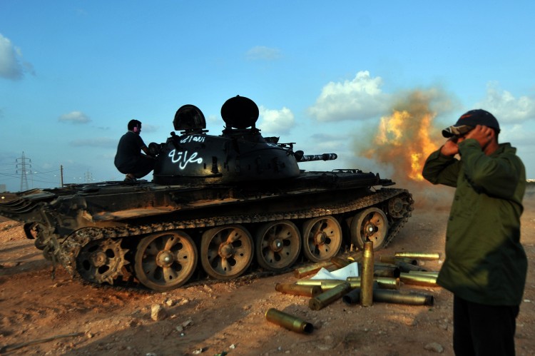 A Libyan National Transitional Council (NTC) tank shells positions of Moammar Gadhafi loyalists from an outpost on the west side of Sirte on September 29, 2011. (Aris Messinis/AFP/Getty Images)