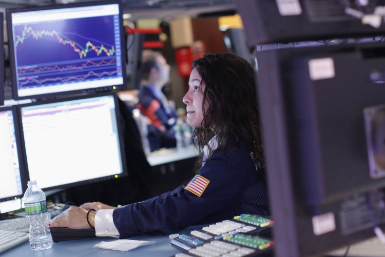 A trader works on the floor of the New York Stock Exchange, Oct. 3, the first day of the third quarter. As concerns continue over the debt crisis in Europe, The Dow Jones industrial average fell 258 points, or 2.4% in trading.  (Spencer Platt/Getty Images)