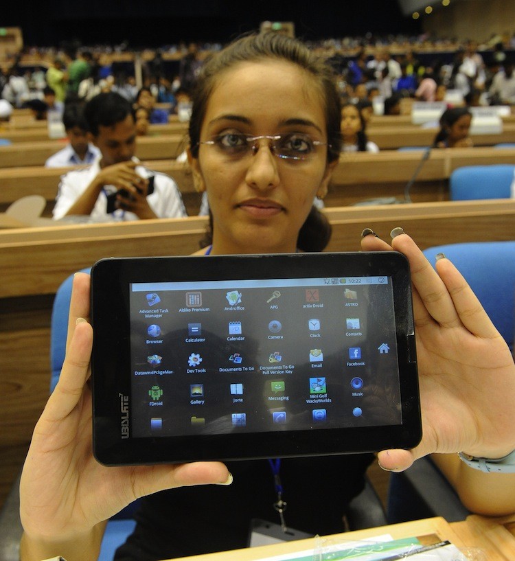 Indian student Sandhaya Nanjani poses with the 'Aakash' $35 tablet computer after its launch in New Delhi, Oct. 5. (Prakash Singh/Getty Images)
