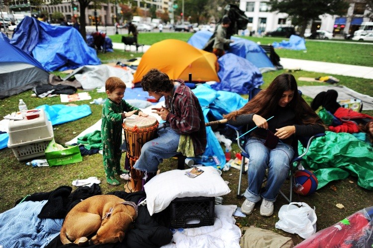A family participates in 'Occupy DC' demonstration at a park in downtown Washington, DC, on October 12, 2011. (Jewel Samad/AFP/Getty Images)
