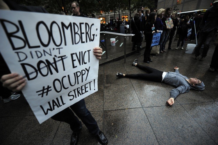 Members of Occupy Wall Street celebrate after learning that they can stay on Zuccotti Park in New York, on October 14, 2011. (Emmanuel Dunad/AFP/Getty Images)