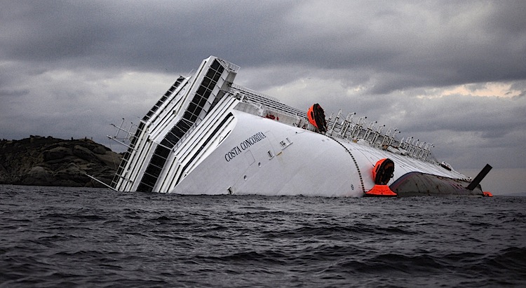 The Costa Concordia cruise ship lies on its side