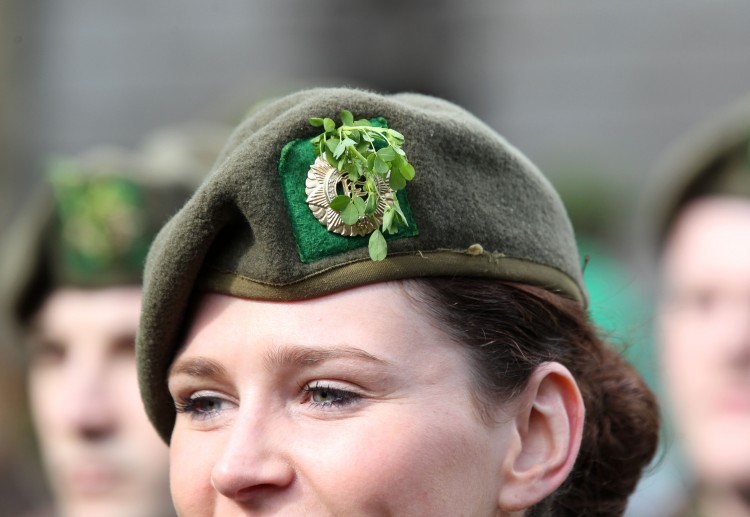 Picture of an Irish female army officer wearing a shamrock in her cap as she marches in the St Patrick's Day festivities in Dublin, Ireland on March 17, 2012. 