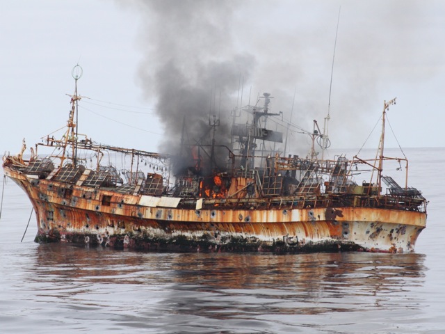 A Japanese fishing vessel Ryou-Un Maru smoulders