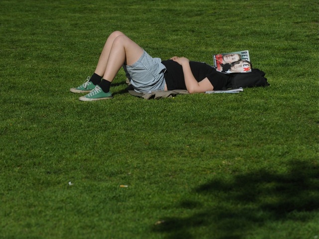 A man sleeps in the grass in April, 2012 in Prague.