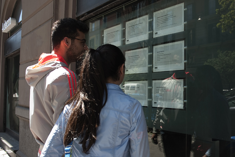 Two people look at job announcements on the window of an agency in Naples on May 3, 2012. Italy's unemployment rate hit a record of 9.8 per cent in March, official data showed on May 2, as a recession in the eurozone's third-biggest economy deepens. (Anna Monaco/AFP/GettyImages)