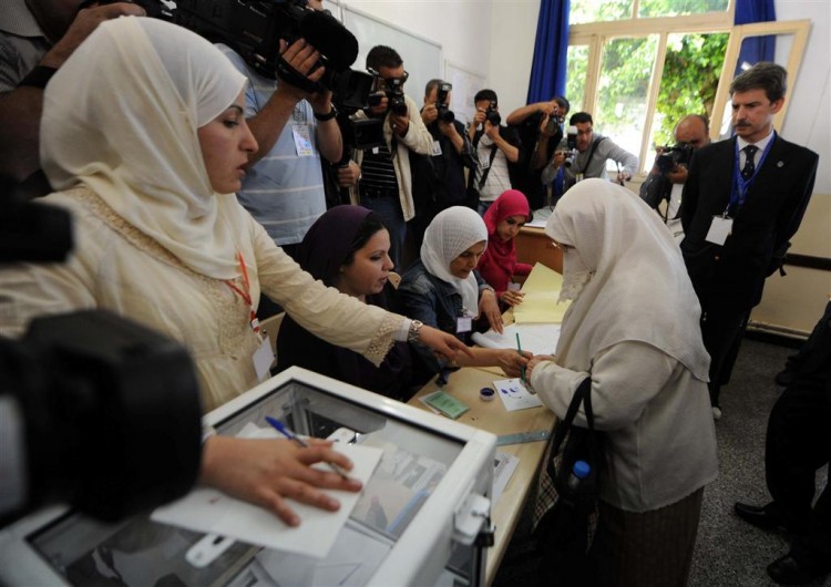 Algerians vote in a polling station in the capital Algiers.