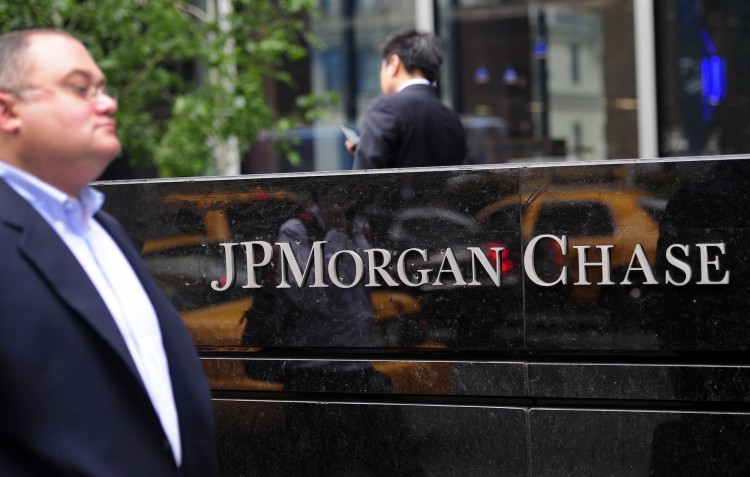People walk past JP Morgan Chase & Co headquarters in New York, May 14. (Emmanuel Dunand/AFP/GettyImages) 