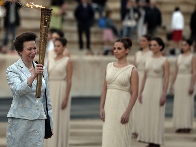 Princess Anne of Britain holds the Olympic torch