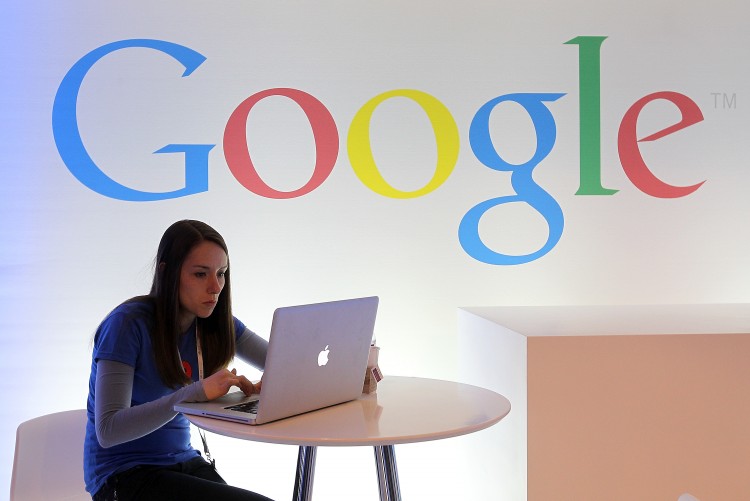 A Google employee works on a laptop before the start of a new conference about Google Maps on June 6, 2012 in San Francisco, California. (Justin Sullivan/Getty Images)