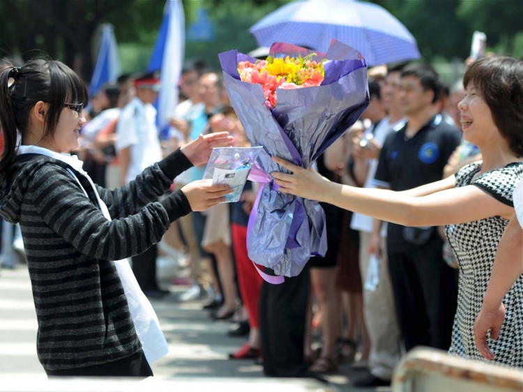 A mother greets her daughter 