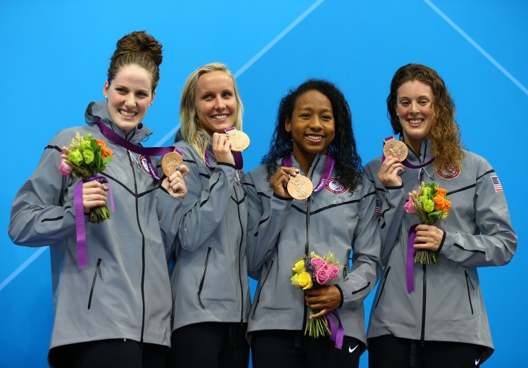 (L-R) Missy Franklin, Jessica Hardy, Lia Neal, and Allison Schmitt of the United States celebrate their bronze medal win for the Women's 4x100m Freestyle Relay at the London 2012 Olympic Games on July 28. (Al Bello/Getty Images)