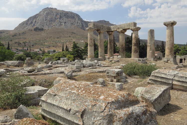 Columns of the former Temple of Apollo stand at the archeological site of Corinth with the ancient fortification of Corinth on a hilltop nearby on August 1, 2012. (Sean Gallup/Getty Images) 