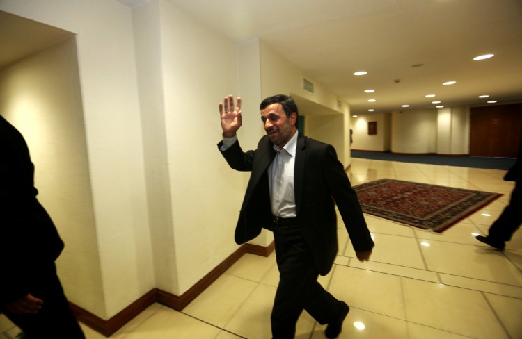 Iranian President Mahmoud Ahmadinejad waves as he walks into a room for his meetings on the sidelines of the Non-Aligned Movement (NAM) summit in Tehran on August 31, 2012. UN chief Ban Ki-moon has called on Iran to free all its political prisoners, in a speech obtained by AFP and delivered in Tehran on the sidelines of a Non-Aligned Movement summit. (BEHROUZ MEHRI/AFP/GettyImages)