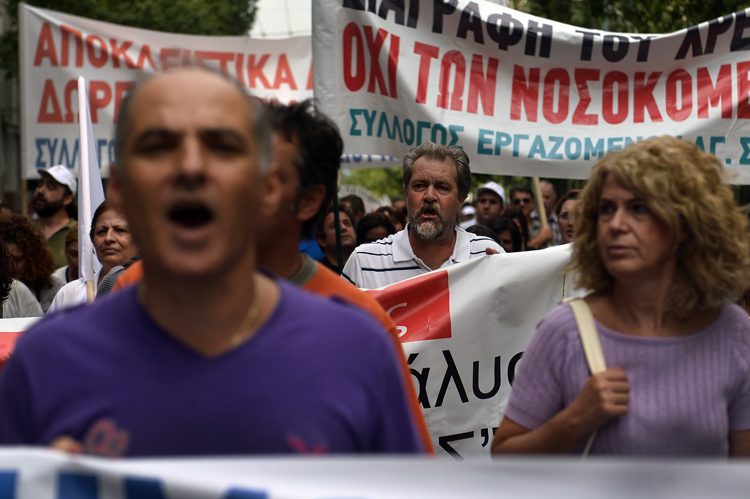 Health workers protest outside the Health Ministry in Athens