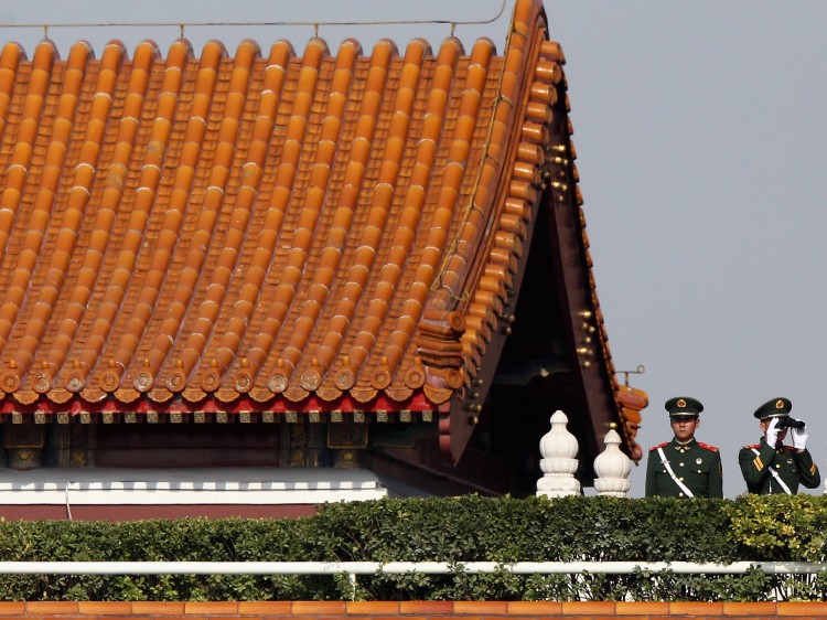 paramilitary policemen monitor the square