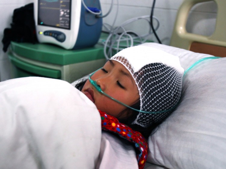 A girl lying on a hospital bed