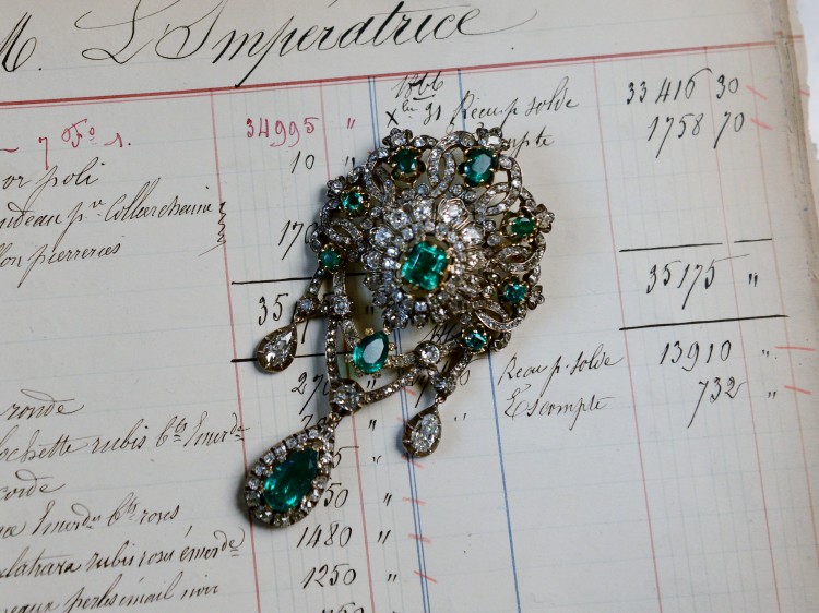 Corsage pin made of emeralds.
