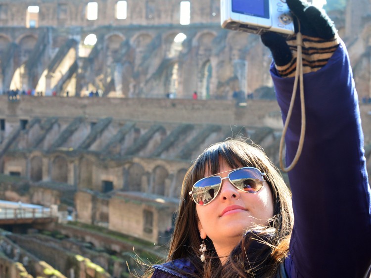 Tourist holding camera.