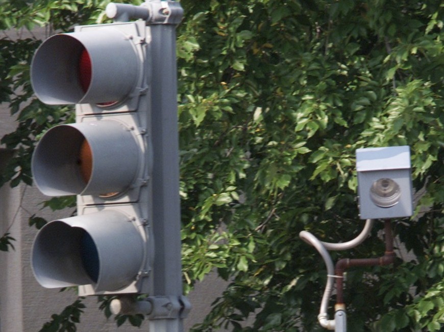 A camera is placed near a traffic light for drivers who run red lights on Constitution Avenue August 31, 2001 in Washington, DC. The camera will take a picture of the car and license plate and the offender will be mailed a citation. (Mark Wilson/Getty Images)