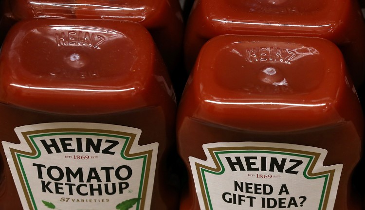 Bottles of Heinz ketchup are displayed on a shelf at Bryan's Market on February 14, 2013 in San Francisco, California. Billionaire investor Warren Buffett's Berkshire Hathaway is is teaming up with the Brazilian investment group 3G Capital to buy H.J. Heinz Co. for $23.3 billion. (Photo by Justin Sullivan/Getty Images)
